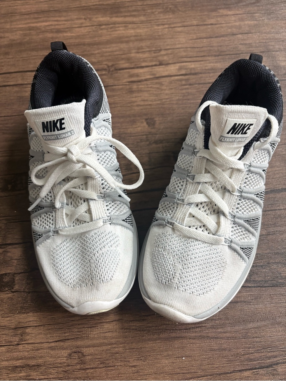 Nike Women’s White and Black Flyknit Sneakers